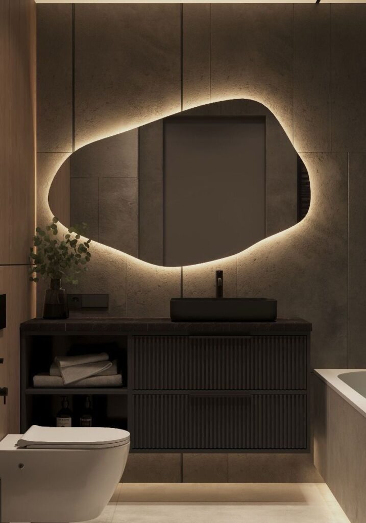 Καθρέπτης μπάνιου κρεμαστός σε σχήμα βότσαλο με φωτισμό led και διακόπτη on/off με τεχνολογία αφής με dimmer και smart λειτουργείες. Δυνατότητα επιλογής διαστάσεων και χρώματος φωτισμού θερμού, ψυχρού ή RGB